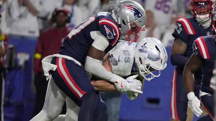 Buffalo Bills tight end Dalton Kincaid gets tackled by New England Patriots safety Craig Woodson after gaining about 10 yards on the play during second half action at Highmark Stadium in Orchard Park on Oct. 5, 2025. Buffalo Bills tight end Dalton Kincaid gets tackled by New England Patriots safety Craig Woodson after gaining about 10 yards on the play during second half action at Highmark Stadium in Orchard Park on Oct. 5, 2025.