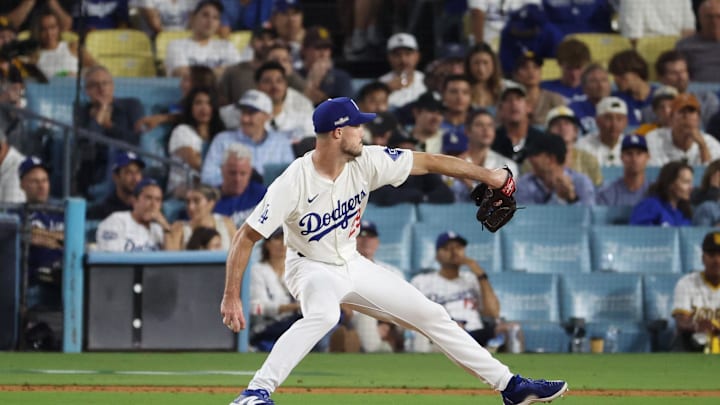 Oct 6, 2024; Los Angeles, California, USA; Los Angeles Dodgers pitcher Michael Grove (29) pitches against the San Diego Padres in the eighth inning during game two of the NLDS for the 2024 MLB Playoffs at Dodger Stadium. Mandatory Credit: Kiyoshi Mio-Imagn Images