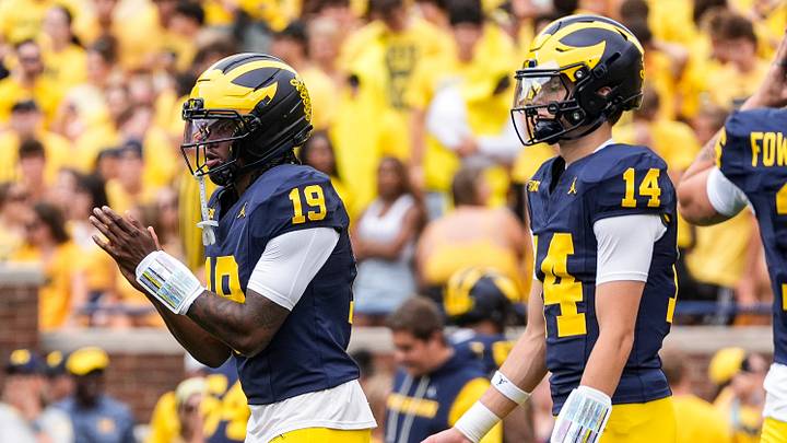 Michigan quarterback Bryce Underwood (19) practices next to quarterback Tommy Carr (14) at Michigan Stadium in Ann Arbor ahead of the game between Michigan and Oklahoma on Saturday, Sept. 12, 2026. Michigan quarterback Bryce Underwood (19) practices next to quarterback Tommy Carr (14) at Michigan Stadium in Ann Arbor ahead of the game between Michigan and Oklahoma on Saturday, Sept. 12, 2026.