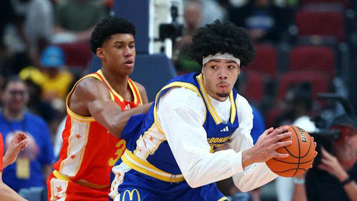 Mar 31, 2026; Glendale, AZ, USA; Tyran Stokes (4) controls the ball against Bruce Branch III (3) during the McDonalds All American Boys Game at Desert Diamond Arena. Mandatory Credit: Mark J. Rebilas-Imagn Images