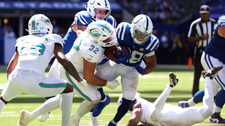 Miami Dolphins defensive tackle Zach Sieler (92) tackles Indianapolis Colts running back Jonathan Taylor (28) during the first half at Lucas Oil Stadium. Miami Dolphins defensive tackle Zach Sieler (92) tackles Indianapolis Colts running back Jonathan Taylor (28) during the first half at Lucas Oil Stadium.