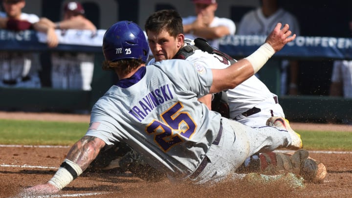 LSU base runner Hayden Travinski is out at home as Texas A&M catcher Max Kaufer holds onto the throw on a safety squeeze play during the SEC Tournament elimination game Friday, May 26, 2023, at the Hoover Met.