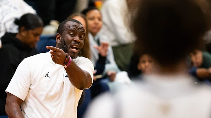 St. Thomas Aquinas head coach Julius Sandi coaches from the sidelines during the first half. Gibbs High School played St. Thomas Aquinas in the championship game of the Kingdom of the Sun at Vanguard High School in Ocala, FL on Monday, December 30, 2024. St. Thomas Aquinas defeated the Raiders 80-64. [Doug Engle/Ocala Star Banner]