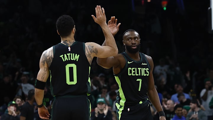 Feb 28, 2025; Boston, Massachusetts, USA; Boston Celtics guard Jaylen Brown (7) high fives forward Jayson Tatum (0) after the Cleveland Cavaliers called a timeout during the first quarter at TD Garden. Mandatory Credit: Winslow Townson-Imagn Images