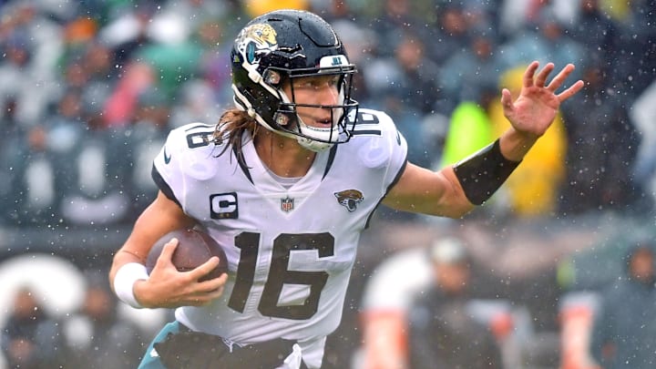 Oct 2, 2022; Philadelphia, Pennsylvania, USA;  Jacksonville Jaguars quarterback Trevor Lawrence (16) looks for room to run during the third quarter against the Philadelphia Eagles at Lincoln Financial Field. Mandatory Credit: Eric Hartline-Imagn Images