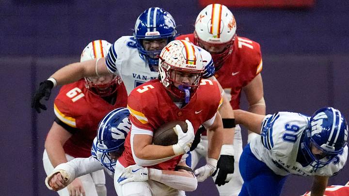 Kuemper Catholic’s Jarin Hoffman (5) carries the ball against the Van Meter Bulldogs Nov. 21, 2025 during the Class 2A high school state football championship at the UNI-Dome in Cedar Falls, Iowa.