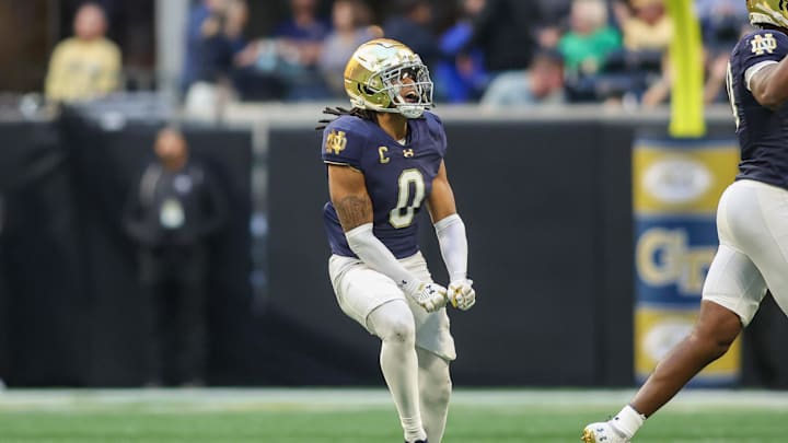 Oct 19, 2024; Atlanta, Georgia, USA; Notre Dame Fighting Irish safety Xavier Watts (0) celebrates after an interception against the Georgia Tech Yellow Jackets in the fourth quarter at Mercedes-Benz Stadium. Mandatory Credit: Brett Davis-Imagn Images
