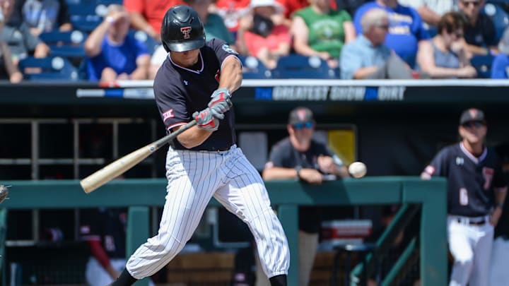 Texas Tech Red Raiders infielder Dru Baker (4) drives in a run in the sixth inning against the Michigan Wolverines in the 2019 College World Series at TD Ameritrade Park in 2019. Texas Tech Red Raiders infielder Dru Baker (4) drives in a run in the sixth inning against the Michigan Wolverines in the 2019 College World Series at TD Ameritrade Park in 2019.