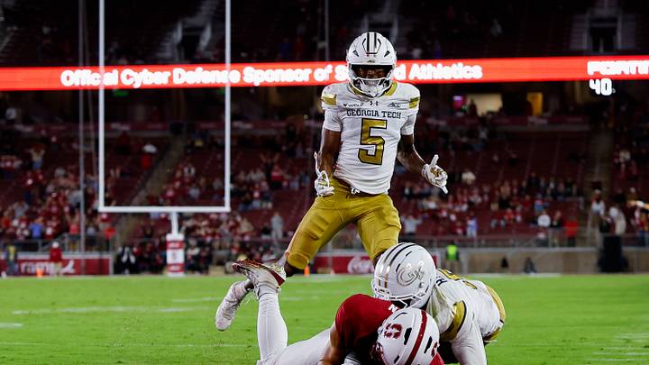 Sep 26, 2026; Stanford, California, USA; Stanford Cardinal wide receiver Nico Brown (23) scores a touchdown against Georgia Tech Yellow Jackets defensive back Zachary Tobe (5) during the third quarter at Stanford Stadium. Mandatory Credit: Sergio Estrada-Imagn Images Sep 26, 2026; Stanford, California, USA; Stanford Cardinal wide receiver Nico Brown (23) scores a touchdown against Georgia Tech Yellow Jackets defensive back Zachary Tobe (5) during the third quarter at Stanford Stadium. Mandatory Credit: Sergio Estrada-Imagn Images