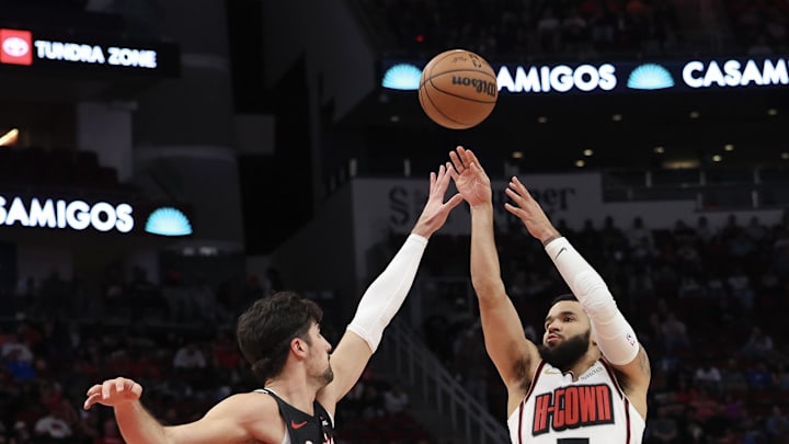 Nov 23, 2024; Houston, Texas, USA; Houston Rockets guard Fred VanVleet (5) shoots against Portland Trail Blazers forward Deni Avdija (8) in the second quarter at Toyota Center. Mandatory Credit: Thomas Shea-Imagn Images