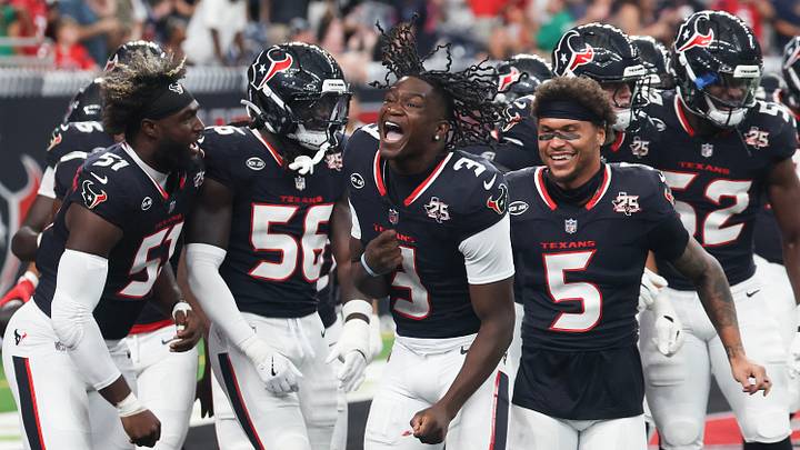 Aug 20, 2026; Houston, Texas, USA;  From left to right, Houston Texans defensive end Will Anderson Jr. (51) linebacker Jamal Hill (56) cornerback Kamari Lassiter (3) and safety Jalen Pitre (5) celebrate linebacker Wade Woodaz (30) (not pictured) interception that he returned for a touchdown against the Las Vegas Raiders in the first half at Reliant Stadium. Mandatory Credit: Thomas Shea-Imagn Images