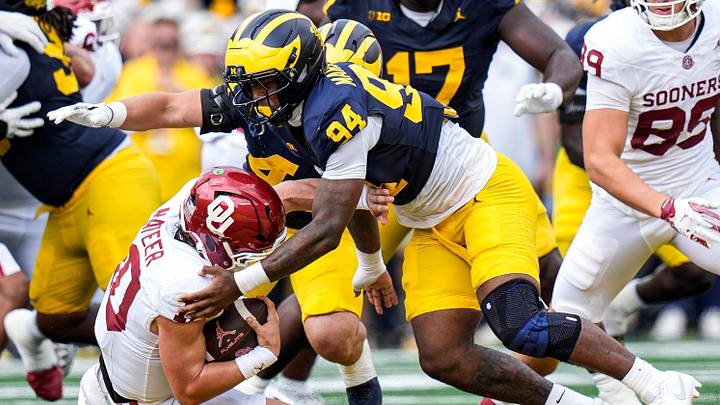 Michigan defensive end Nate Marshall (94) sacks Oklahoma quarterback John Mateer (10) during the first half at Michigan Stadium in Ann Arbor on Saturday, Sept. 12, 2026. Michigan defensive end Nate Marshall (94) sacks Oklahoma quarterback John Mateer (10) during the first half at Michigan Stadium in Ann Arbor on Saturday, Sept. 12, 2026.