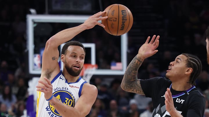 Jan 28, 2026; Salt Lake City, Utah, USA; Golden State Warriors guard Stephen Curry (30) makes a pass over Utah Jazz guard Keyonte George (3) during the second half at Delta Center. Mandatory Credit: Rob Gray-Imagn Images