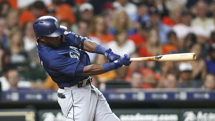 Seattle Mariners center fielder Guillermo Heredia (5) hits a single during the second inning against the Houston Astros at Minute Maid Park in 2018.
