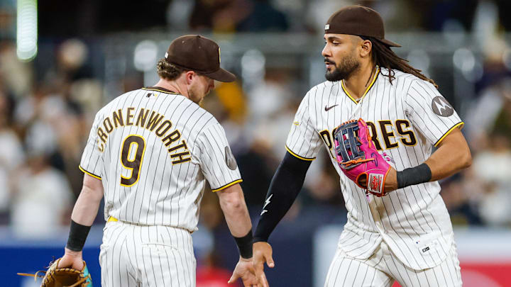 Apr 14, 2026; San Diego, California, USA; San Diego Padres right fielder Fernando Tatis Jr. (23) celebrates with second baseman Jake Cronenworth (9) after defeating the Seattle Mariners at Petco Park. Mandatory Credit: David Frerker-Imagn Images