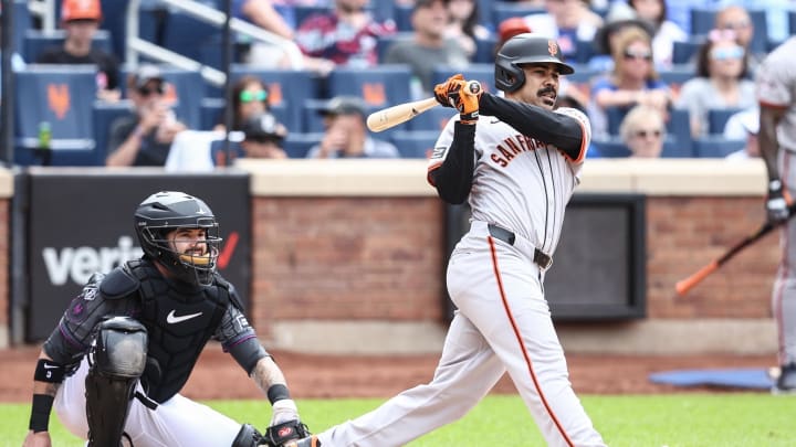 May 25, 2024; New York City, New York, USA;  San Francisco Giants pinch hitter LaMonte Wade Jr. (31) hits an RBI single in the ninth inning to tie the game against the New York Mets at Citi Field. Mandatory Credit: Wendell Cruz-USA TODAY Sports