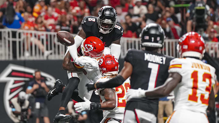 Sep 22, 2024; Atlanta, Georgia, USA; Kansas City Chiefs safety Bryan Cook (6) breaks up a pass against Atlanta Falcons tight end Kyle Pitts (8) in the end zone during the second half at Mercedes-Benz Stadium. Mandatory Credit: Dale Zanine-Imagn Images