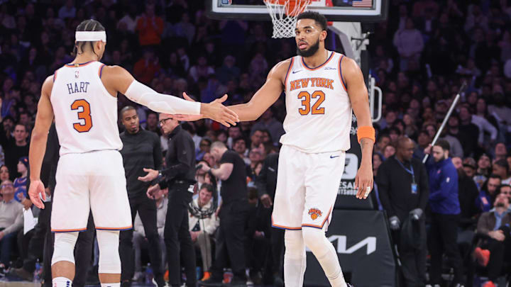 Feb 12, 2025; New York, New York, USA;  New York Knicks center Karl-Anthony Towns (32) is greeted by guard Josh Hart (3) during a timeout in the second quarter against the Atlanta Hawks at Madison Square Garden. Mandatory Credit: Wendell Cruz-Imagn Images