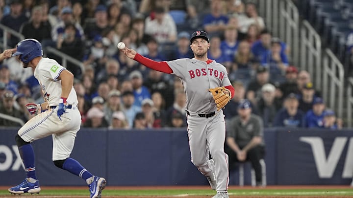Apr 29, 2025; Toronto, Ontario, CAN; Boston Red Sox third baseman Alex Bregman (2) throws out Toronto Blue Jays left fielder Myles Straw (not pictured) at first base to end the seventh inning at Rogers Centre. Mandatory Credit: John E. Sokolowski-Imagn Images