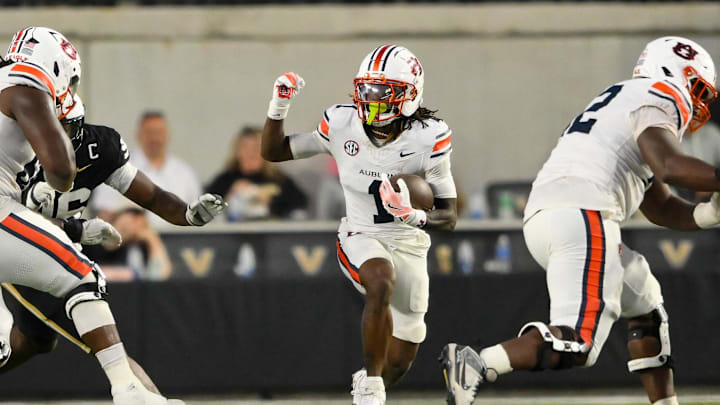 Nov 8, 2025; Nashville, Tennessee, USA;  Auburn Tigers wide receiver Eric Singleton Jr. (1) runs with the ball after a made catch against the Vanderbilt Commodores during the first half at FirstBank Stadium. Mandatory Credit: Steve Roberts-Imagn Images
