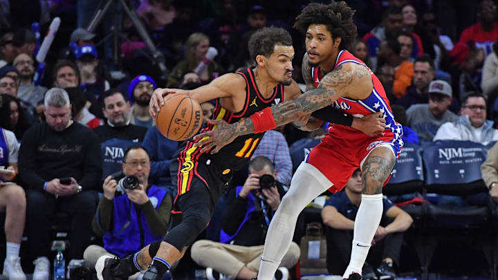 Feb 9, 2024; Philadelphia, Pennsylvania, USA; Atlanta Hawks guard Trae Young (11) is defended by Philadelphia 76ers guard Kelly Oubre Jr. (9) during the third quarter at Wells Fargo Center. Mandatory Credit: Eric Hartline-Imagn Images
