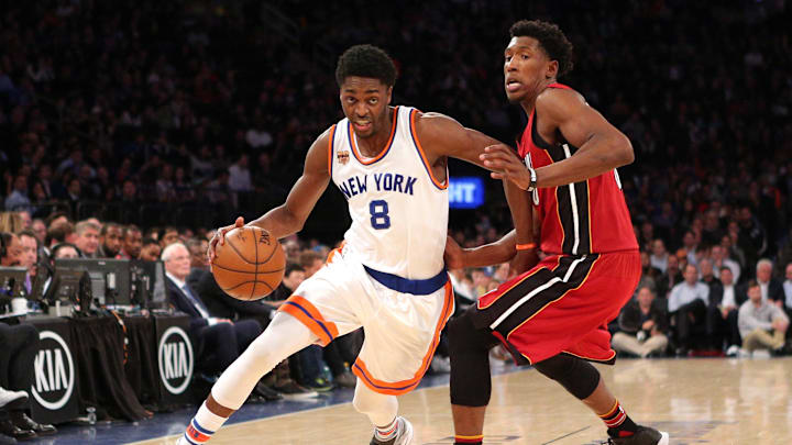 Mar 29, 2017; New York, NY, USA; New York Knicks shooting guard Justin Holiday (8) drives against Miami Heat shooting guard Josh Richardson (0) during the third quarter at Madison Square Garden. Mandatory Credit: Brad Penner-Imagn Images