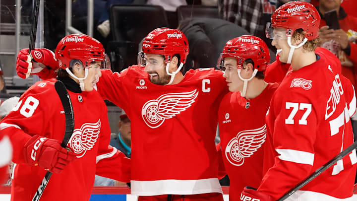 Oct 19, 2025; Detroit, Michigan, USA;  Detroit Red Wings center Dylan Larkin (71) celebrates with his teammates after scoring a goal against the Edmonton Oilers during the second period at Little Caesars Arena. Mandatory Credit: Rick Osentoski-Imagn Images