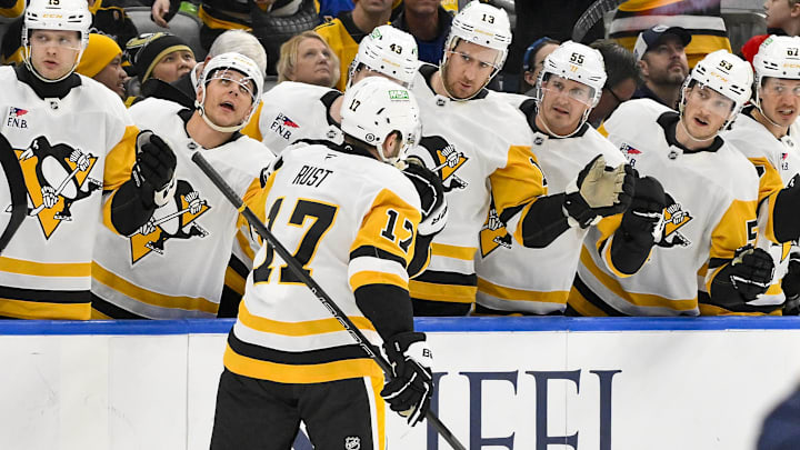 Apr 3, 2025; St. Louis, Missouri, USA;  Pittsburgh Penguins right wing Bryan Rust (17) is congratulated by teammates after scoring against the St. Louis Blues during the first period at Enterprise Center. Mandatory Credit: Jeff Curry-Imagn Images