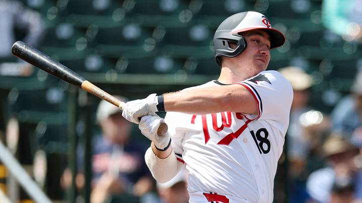 Mar 4, 2026; Fort Myers, Florida, USA; Minnesota Twins center fielder Alan Roden (18) triples against Puerto Rico in the second inning during spring training at Lee Health Sports Complex/Hammond Stadium. Mandatory Credit: Nathan Ray Seebeck-Imagn Images