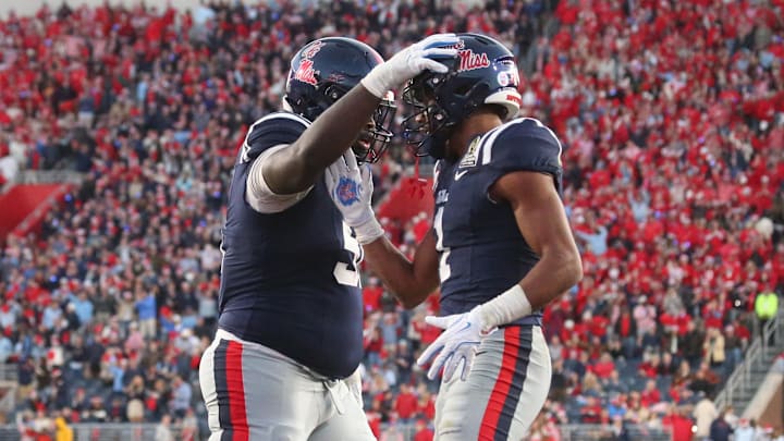 Dec 20, 2025; Oxford, MS, USA; Mississippi Rebels wide receiver De'Zhaun Stribling (1) reacts with a teammate after scoring a touchdown against the Tulane Green Wave during the second half of a game at Vaught-Hemingway Stadium. Mandatory Credit: Petre Thomas-Imagn Images