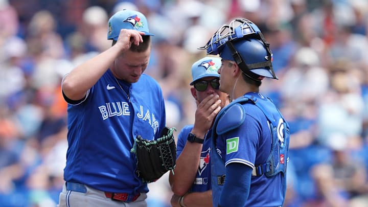 Mar 15, 2026; Port St. Lucie, Florida, USA;  Toronto Blue Jays pitching coach Pete Walker (41) talks with pitcher Grant Rogers (69) and catcher Brandon Valenzuela (59) in the second inning against the New York Mets at Clover Park. Mandatory Credit: Jim Rassol-Imagn Images