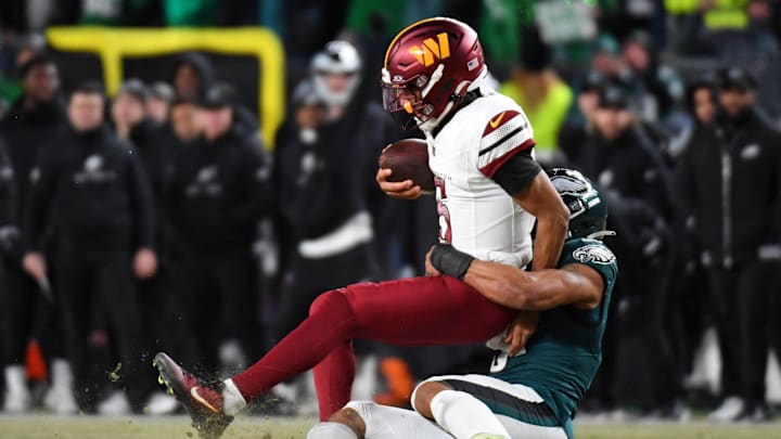 Philadelphia Eagles linebacker Nolan Smith Jr. sacks Washington Commanders quarterback Jayden Daniels.