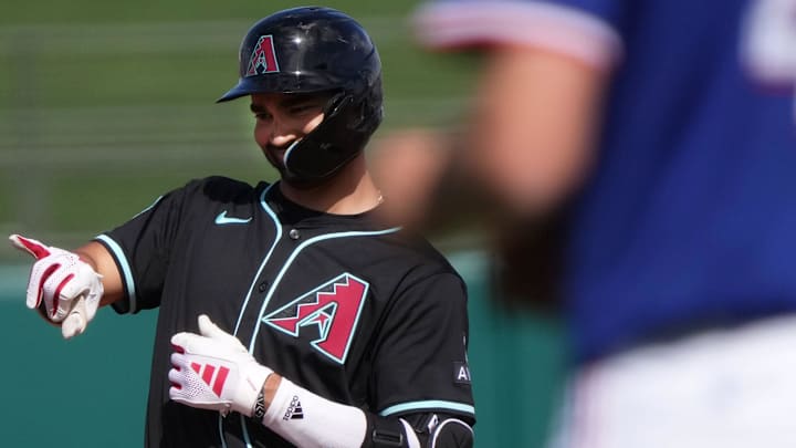 Arizona Diamondbacks' Jordan Lawlar (10) celebrates his RBI double against the Texas Rangers at Surprise Stadium on Sunday, March 2, 2025. Arizona Diamondbacks' Jordan Lawlar (10) celebrates his RBI double against the Texas Rangers at Surprise Stadium on Sunday, March 2, 2025.