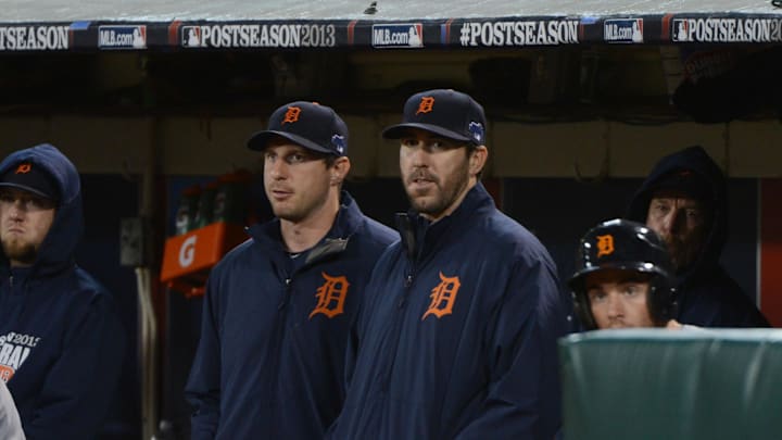 October 10, 2013; Oakland, CA, USA; Detroit Tigers starting pitcher Max Scherzer (37, left) and starting pitcher Justin Verlander (35, right) stand in the dugout during the ninth inning in game five of the American League divisional series playoff baseball game against the Oakland Athletics at O.co Coliseum. The Tigers defeated the Athletics 3-0. 