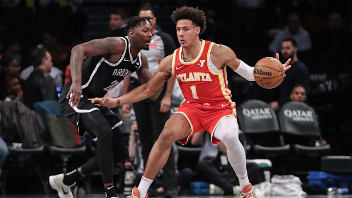 Jalen Johnson dribbles the ball