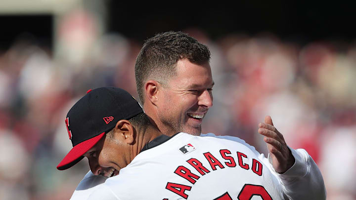 Former Cleveland pitcher Corey Kluber, facing, hugs Guardians pitcher Carlos Carrasco (59) before the team’s home opener against the Chicago White Sox, Monday, April 8, 2024.