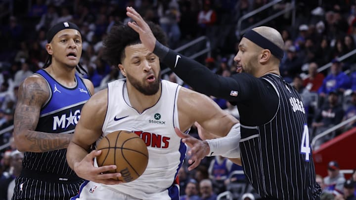 Apr 19, 2026; Detroit, Michigan, USA; Detroit Pistons guard Cade Cunningham (2) is defended by Orlando Magic guard Jalen Suggs (4) in the second half during the 2026 NBA Playoffs at Little Caesars Arena. Mandatory Credit: Rick Osentoski-Imagn Images