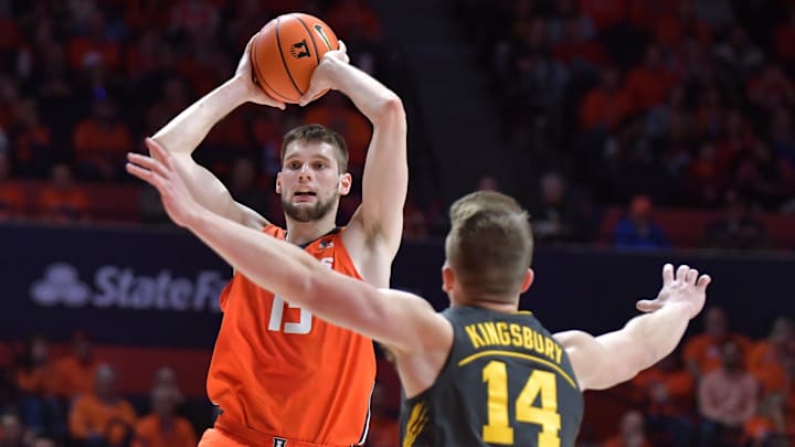 Feb 25, 2025; Champaign, Illinois, USA; Illinois Fighting Illini center Tomislav Ivisic (13) looks to pass as Iowa Hawkeyes guard Carter Kingsbury (14) defends during the first half at State Farm Center. Mandatory Credit: Ron Johnson-Imagn Images Feb 25, 2025; Champaign, Illinois, USA; Illinois Fighting Illini center Tomislav Ivisic (13) looks to pass as Iowa Hawkeyes guard Carter Kingsbury (14) defends during the first half at State Farm Center. Mandatory Credit: Ron Johnson-Imagn Images