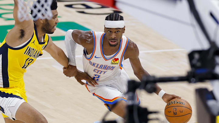 Jun 16, 2025; Oklahoma City, Oklahoma, USA; Oklahoma City Thunder guard Shai Gilgeous-Alexander (2) brings the ball up court past Indiana Pacers center Tony Bradley (13) during the second quarter in game five of the 2025 NBA Finals at Paycom Center. Mandatory Credit: Alonzo Adams-Imagn Images