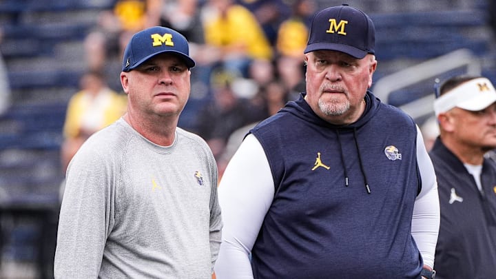 Michigan offensive coordinator Chip Lindsey, left, and defensive coordinator Wink Martindale watch warm up ahead of the Central Michigan game at Michigan Stadium in Ann Arbor on Saturday, Sept. 13, 2025.