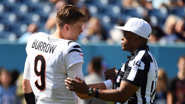 Oct 1, 2023; Nashville, Tennessee, USA; Cincinnati Bengals quarterback Joe Burrow (9) talks with referee Shawn Smith (14) before the game against the Tennessee Titans at Nissan Stadium. Mandatory Credit: Christopher Hanewinckel-USA TODAY Sports Oct 1, 2023; Nashville, Tennessee, USA; Cincinnati Bengals quarterback Joe Burrow (9) talks with referee Shawn Smith (14) before the game against the Tennessee Titans at Nissan Stadium. Mandatory Credit: Christopher Hanewinckel-USA TODAY Sports