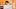 Mother and child dressed as mummies against orange background