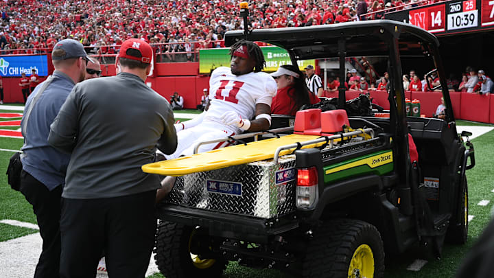 Demitrius Bell is carted off the field during the Nebraska football spring game