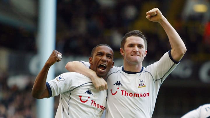 Jermain Defoe and Robbie Keane celebrate against Portsmouth
