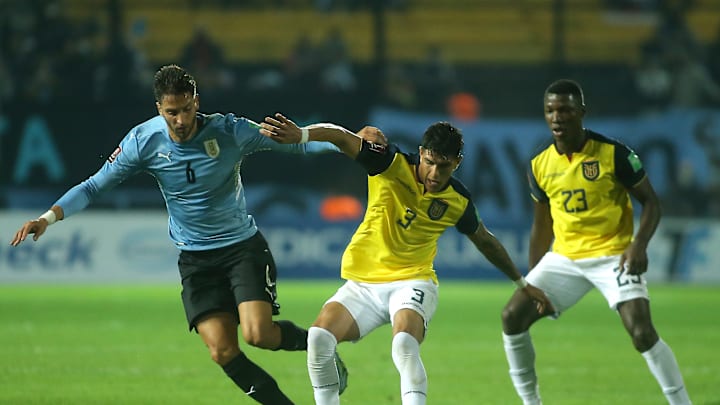 Piero Hincapie and Rodrigo Bentancur battle during a World Cup qualifier 