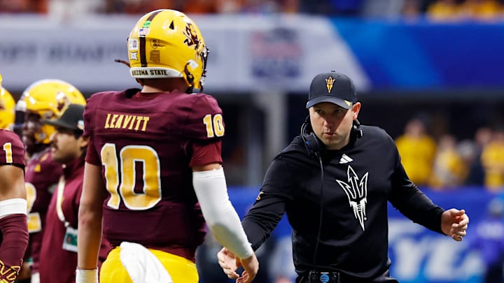 Arizona State head coach Kenny Dillingham greets quarterback Sam Leavitt on the sideline during the Peach Bowl on Jan. 1, 2025.