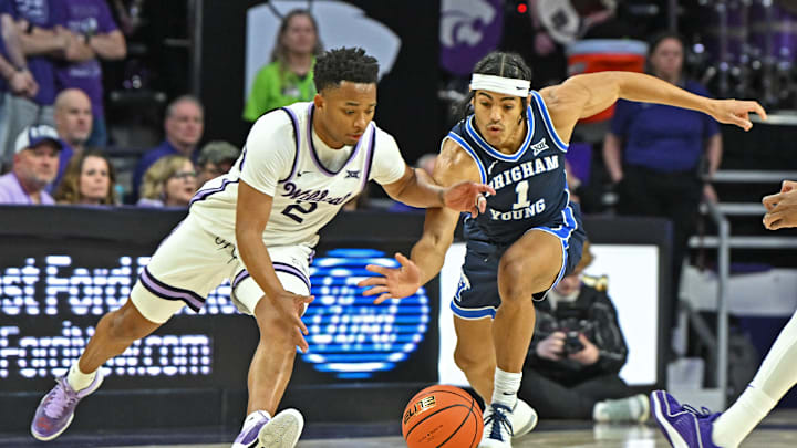 Trey Stewart and Tylor Perry dive for the ball as BYU faces Kansas State