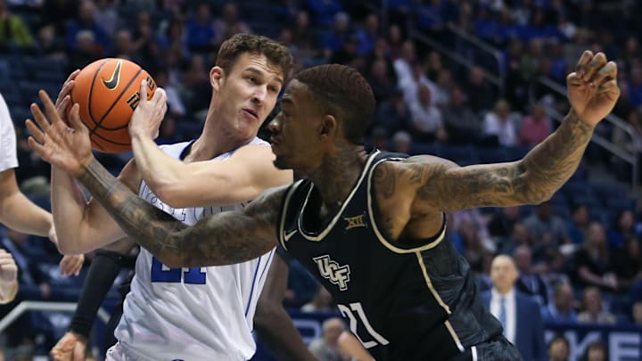 Trevin Knell fights off the UCF defense