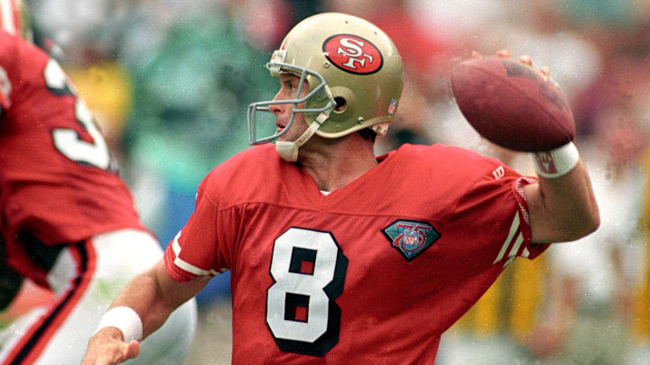 Steve Young slings a pass for the San Francisco 49ers