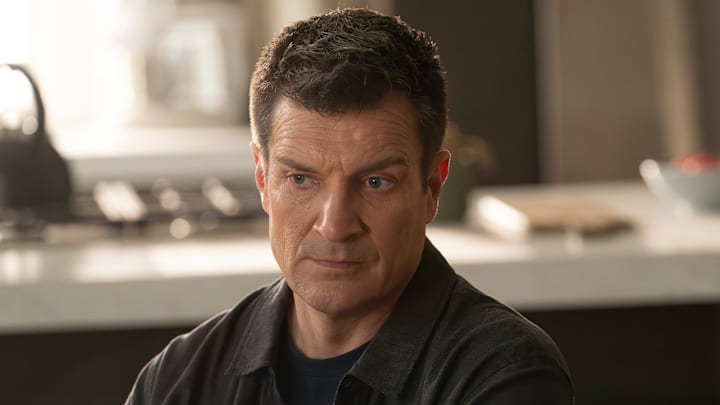 NATHAN FILLION looking surprised from The Rookie